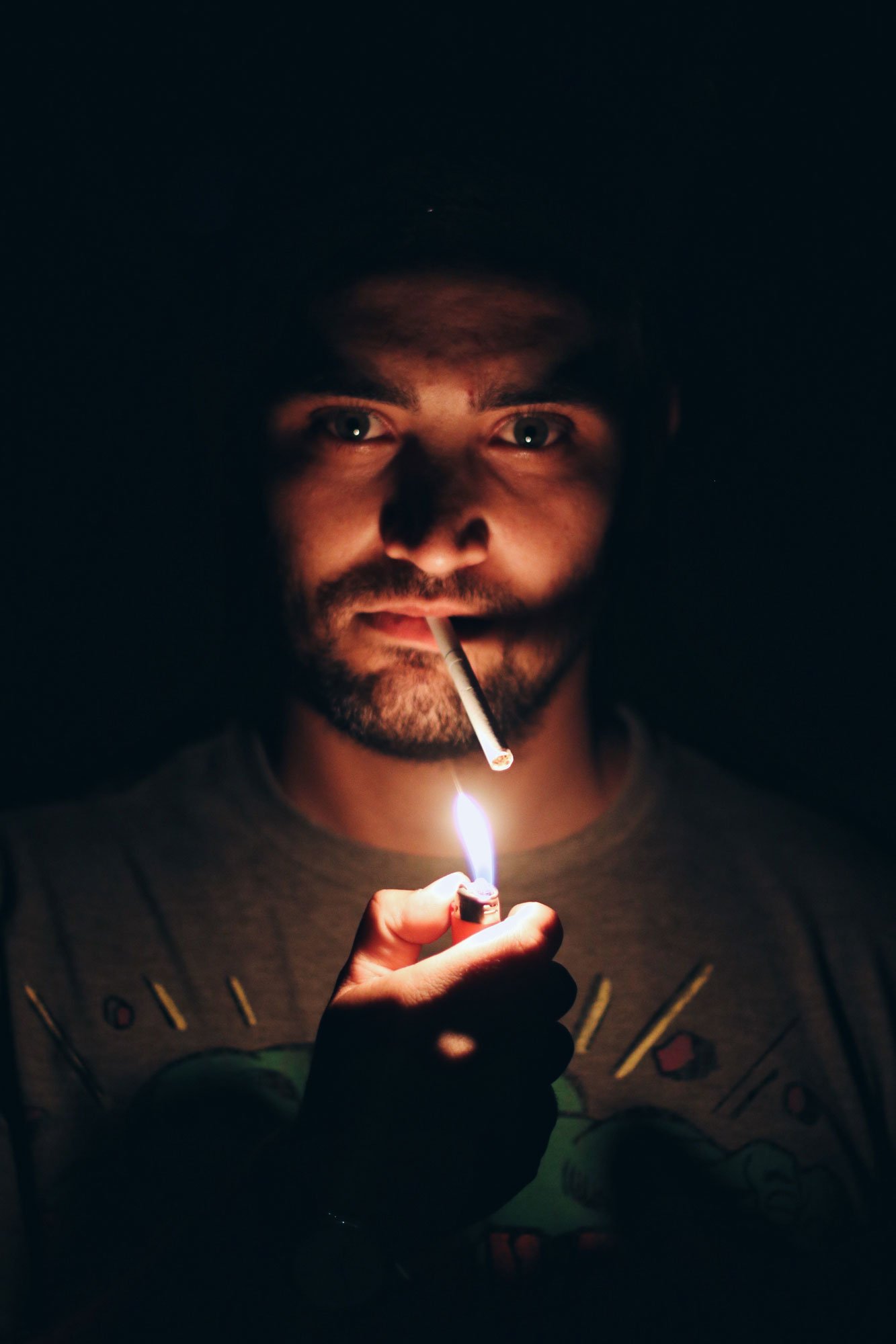 man-lighting-up-a-cigaret-in-the-dark-2022-11-02-03-47-55-utc.jpg